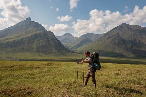 A park ranger backpacking in the mountain wilderness of Gates of the Arctic